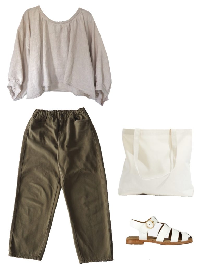 Summer capsule wardrobe outfit ideas - oatmeal gathered linen blouse, olive tapered trousers, canvas tote bag, white leather fisherman sandals
